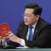FILE - Chinese Foreign Minister Qin Gang reads from the Chinese constitution when answering a question about Taiwan during a press conference held on the sidelines of the annual meeting of China's National People's Congress (NPC) in Beijing, on March 7, 2023. In the weeks since Chinese leader Xi Jinping won a third five-year term as president, setting him on course to remain in power for life, leaders and diplomats from around the world have beaten a path to his door. None more so than those from Europe. (AP Photo/Mark Schiefelbein, File)