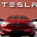The logo marks the showroom and service center for the US automotive and energy company Tesla in Amsterdam on October 23, 2019. (Photo by JOHN THYS / AFP) (Photo by JOHN THYS/AFP via Getty Images)