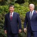 U.S. President Joe Biden waves as he walks with Chinese President Xi Jinping at Filoli estate on the sidelines of the Asia-Pacific Economic Cooperation (APEC) summit, in Woodside, California, U.S., November 15, 2023. REUTERS/Kevin Lamarque