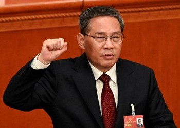 China's newly-elected Premier Li Qiang takes an oath after being elected during the fourth plenary session of the National People's Congress (NPC) at the Great Hall of the People in Beijing, China on March 11, 2023.     GREG BAKER/Pool via REUTERS