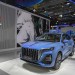 (230828) -- CHANGCHUN, Aug. 28, 2023 (Xinhua) -- A visitor watches a car displayed by FAW Hongqi during the 14th China-Northeast Asia Expo in Changchun, northeast China's Jilin Province, Aug. 23, 2023. (Xinhua/Zhang Nan)