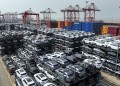 (231207) -- BEIJING, Dec. 7, 2023 (Xinhua) -- This aerial photo taken on July 11, 2023 shows new energy vehicles for export at a terminal of Taicang Port, east China's Jiangsu Province. (Photo by Ji Haixin/Xinhua)