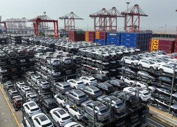 (231207) -- BEIJING, Dec. 7, 2023 (Xinhua) -- This aerial photo taken on July 11, 2023 shows new energy vehicles for export at a terminal of Taicang Port, east China's Jiangsu Province. (Photo by Ji Haixin/Xinhua)