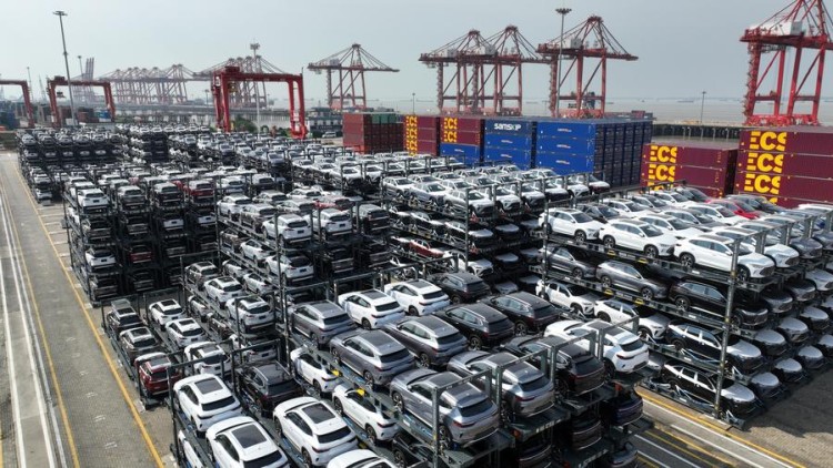 (231207) -- BEIJING, Dec. 7, 2023 (Xinhua) -- This aerial photo taken on July 11, 2023 shows new energy vehicles for export at a terminal of Taicang Port, east China's Jiangsu Province. (Photo by Ji Haixin/Xinhua)