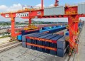 (230920) -- GUANGZHOU, Sept. 20, 2023 (Xinhua) -- This aerial photo taken on Sept. 20, 2023 shows a 50-foot container being loaded onto an intermodal express train at Guangzhou International Port Railway Station in Guangzhou, south China's Guangdong Province. Intermodal express trains loaded with 50-foot containers respectively departed from east China's Shanghai, Guangzhou, Changsha of central China's Hunan Province and Kunming of southwest China's Yunnan Province on Wednesday, joining force of regular freight train service. The 50-foot containers are independently developed by China State Railway Group Co., Ltd. (China Railway), each with a weight of 36 tonnes and a load capacity of 30.85 tonnes. The volume of these containers reaches 114.4 cubic meters, a 50 percent increase over that of 40-foot international standard containers, making them the largest containers by volume that have been put into use in China by far. (Xinhua/Deng Hua)