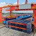 (230920) -- GUANGZHOU, Sept. 20, 2023 (Xinhua) -- This aerial photo taken on Sept. 20, 2023 shows a 50-foot container being loaded onto an intermodal express train at Guangzhou International Port Railway Station in Guangzhou, south China's Guangdong Province. Intermodal express trains loaded with 50-foot containers respectively departed from east China's Shanghai, Guangzhou, Changsha of central China's Hunan Province and Kunming of southwest China's Yunnan Province on Wednesday, joining force of regular freight train service. The 50-foot containers are independently developed by China State Railway Group Co., Ltd. (China Railway), each with a weight of 36 tonnes and a load capacity of 30.85 tonnes. The volume of these containers reaches 114.4 cubic meters, a 50 percent increase over that of 40-foot international standard containers, making them the largest containers by volume that have been put into use in China by far. (Xinhua/Deng Hua)