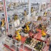(240318) -- BEIJING, March 18, 2024 (Xinhua) -- An aerial drone photo taken on Jan. 8, 2024 shows robotic arms processing components for new energy vehicles at a private company in Changxing Economic and Technological Development Zone of Huzhou City, east China's Zhejiang Province. (Photo by Tan Yunfeng/Xinhua)