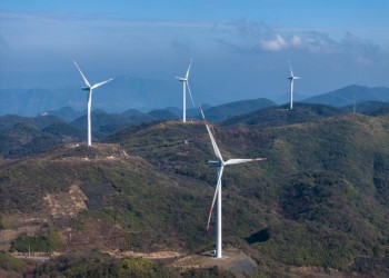 (240111) -- CHONGQING, Jan. 11, 2024 (Xinhua) -- An aerial drone photo taken on Jan. 10, 2024 shows wind turbines in Liutang Township of Shizhu Tujia Autonomous County, southwest China's Chongqing. The installed capacity of wind power and power generation from wind in Shizhu have reached 372,000 kW and 731 million kWh respectively. (Xinhua/Huang Wei)