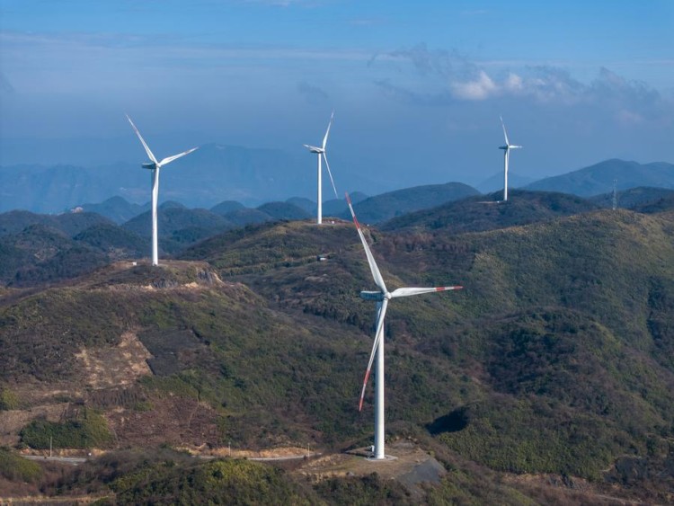 (240111) -- CHONGQING, Jan. 11, 2024 (Xinhua) -- An aerial drone photo taken on Jan. 10, 2024 shows wind turbines in Liutang Township of Shizhu Tujia Autonomous County, southwest China's Chongqing. The installed capacity of wind power and power generation from wind in Shizhu have reached 372,000 kW and 731 million kWh respectively. (Xinhua/Huang Wei)