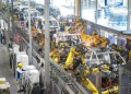 (240402) -- WUHAN, April 2, 2024 (Xinhua) -- A worker works at an assembly line of Voyah, a Chinese luxury electric auto brand, in Wuhan, central China's Hubei Province, April 1, 2024. In recent years, Wuhan enhanced its research ability on energy saving and carbon reduction technologies, aiming to upgrade the automobile industry with technological innovation. (Xinhua/Xiao Yijiu)