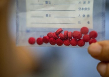(230716) -- MANGSHI, July 16, 2023 (Xinhua) -- Yin Mingyan shows samples of crystal meth in Mangshi City, southwest China's Yunnan Province, July 13, 2023. Yin Mingyan is the deputy head of a law-enforcing team under a border management bureau in Dehong Dai and Jingpo Autonomous Prefecture, southwest China's Yunnan Province.
Back in 1997 when she was still in high school, she lost her brother Yin Mingzhi, a counter-narcotics officer who was seriously wouded and killed while arresting drug traffickers.
She joined the military upon graduation in 1998, and soon decided to fit in her brother's shoes and became a counter-narcotics officer.
She has been involved in more than 100 drug-related cases since then, resulting in the arrest of at least 230 suspects and the seizure of over 400 kilograms of drugs. (Xinhua/Hu Chao)