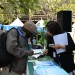 (250725) -- VICTORIA FALLS, July 25, 2025 (Xinhua) -- A participant inquires about China's wetland conservation efforts from a staff member outside the China Pavilion during the 15th Meeting of the Conference of the Contracting Parties to the Ramsar Convention on Wetlands (COP15) in Victoria Falls, Zimbabwe, on July 23, 2025. The 15th Meeting of the Conference of the Contracting Parties to the Ramsar Convention on Wetlands (COP15) opened on Thursday in Zimbabwe's resort city of Victoria Falls, with a call for international cooperation in the global wetland preservation. (Xinhua/Xu Zheng)